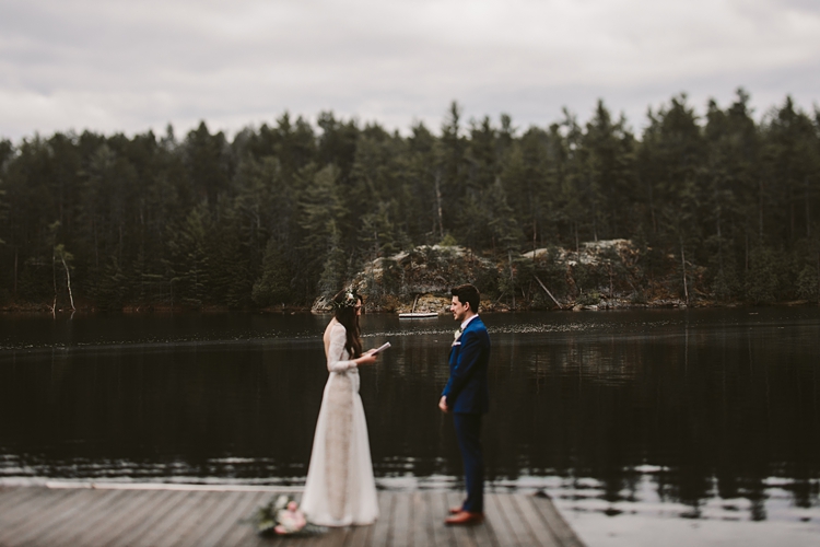 Couple exchanging vows on a dock in Muskoka